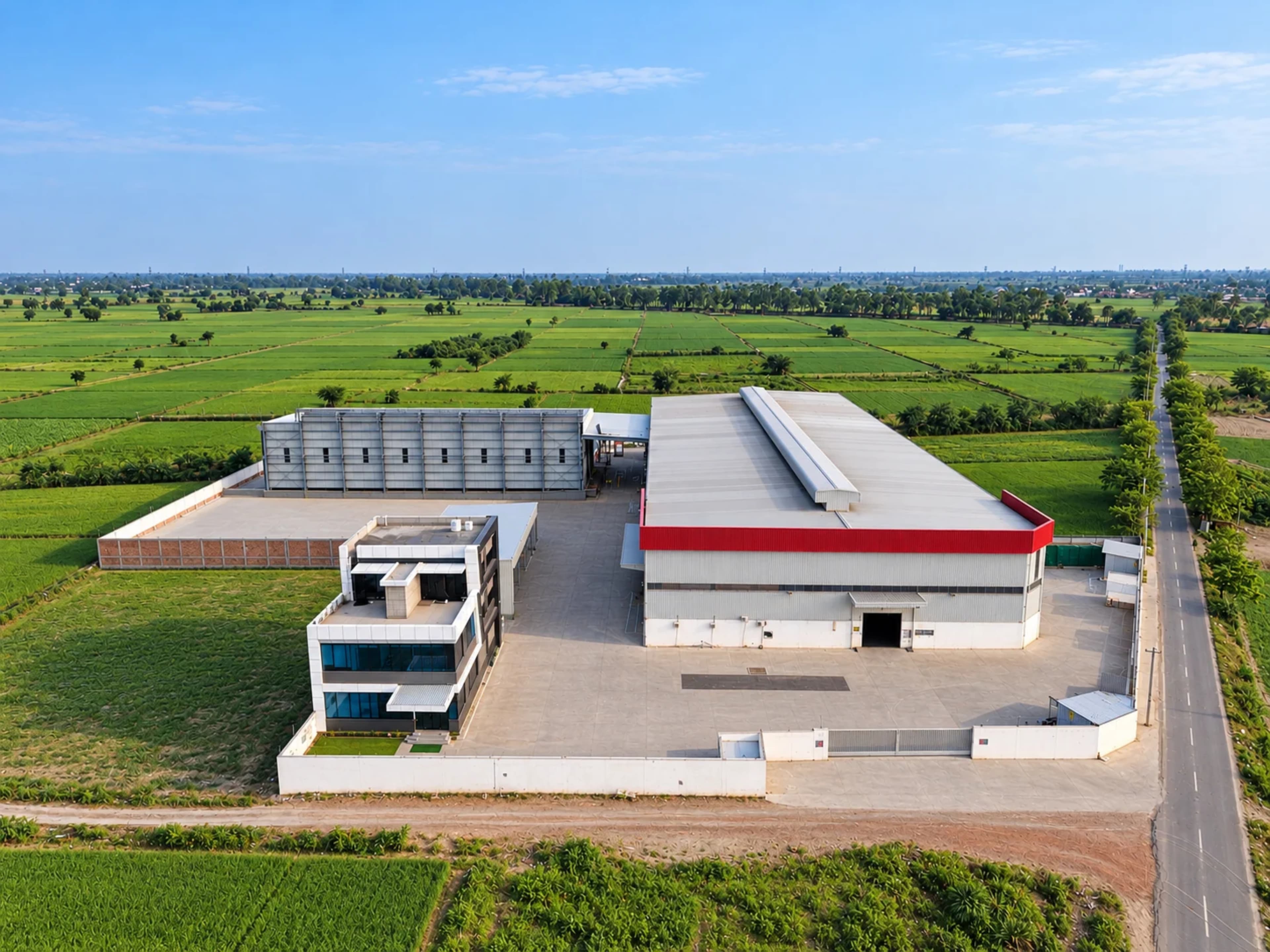 Aerial view of Steelbuild Infra Projects Limited manufacturing facility and industrial steel buildings